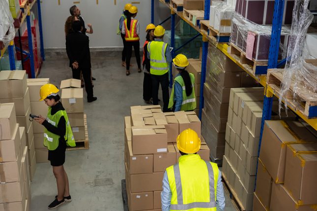 Workers inside a supply chain warehouse